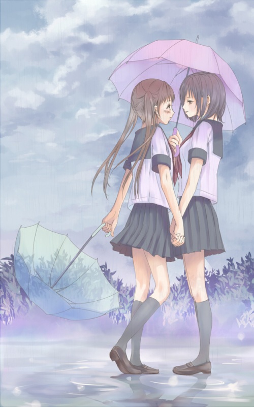 hand holding beneath an umbrella